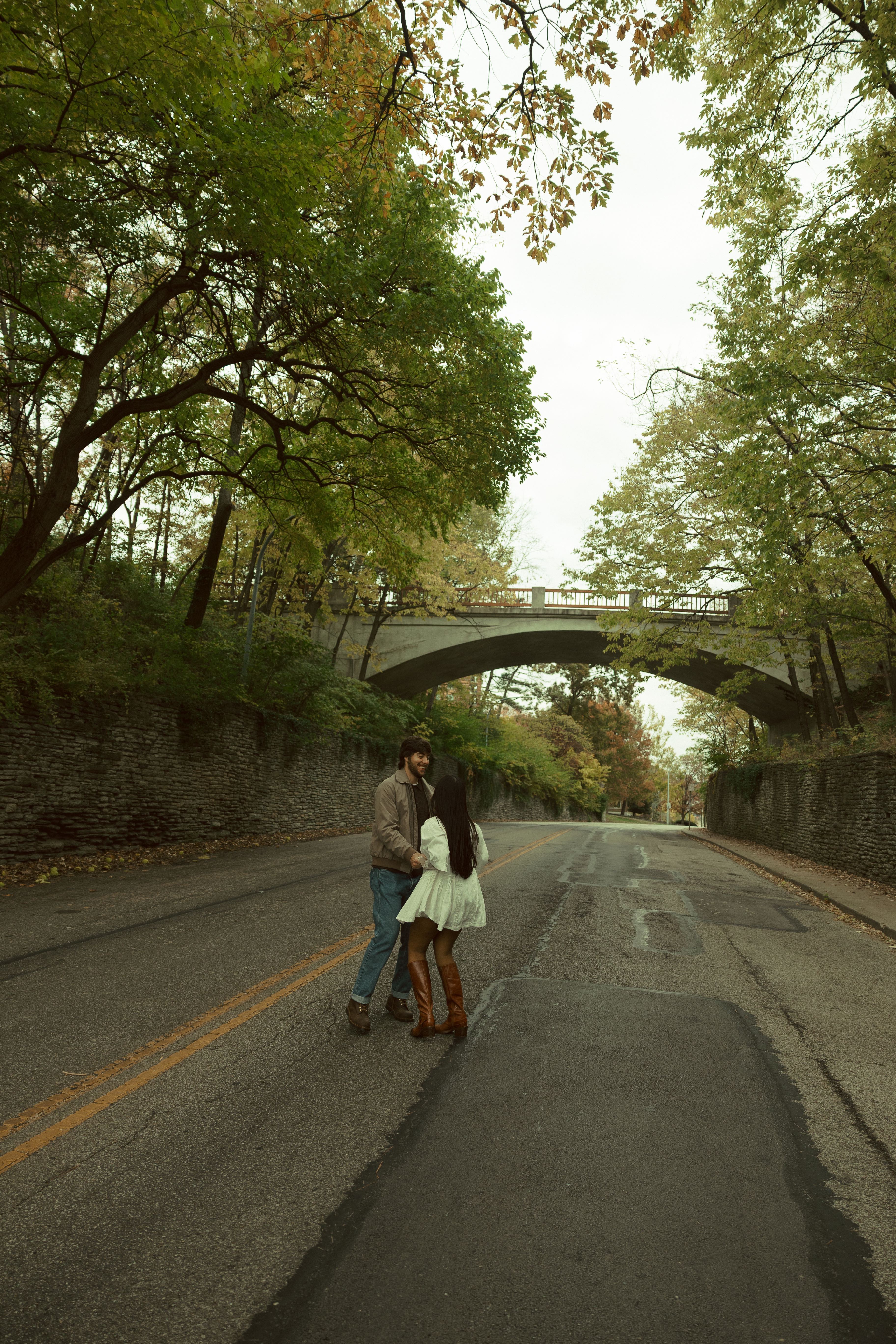 Kheya and Dylan under bridge on road